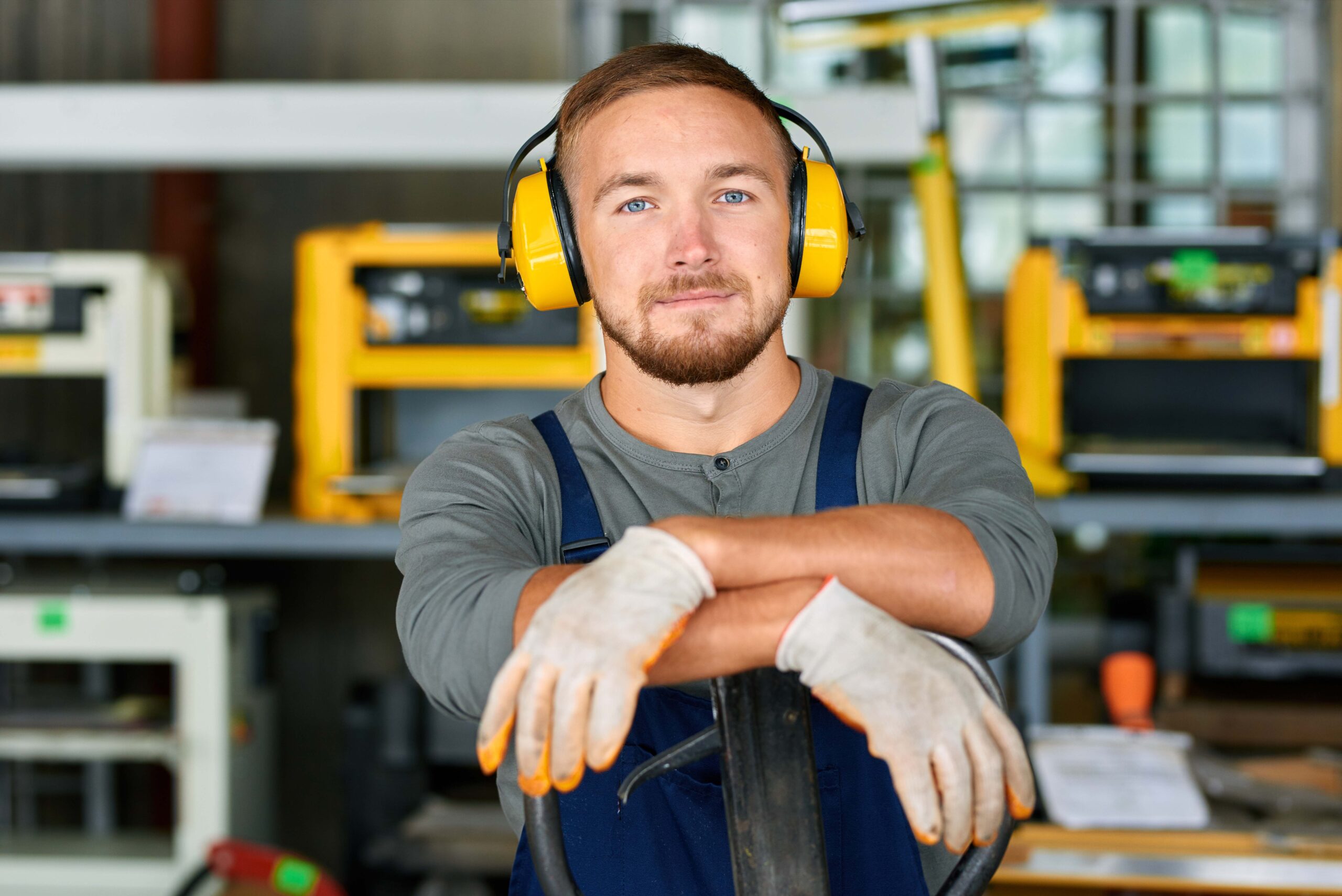 Mobile health professional conducting workplace hearing test for employee wearing headphones