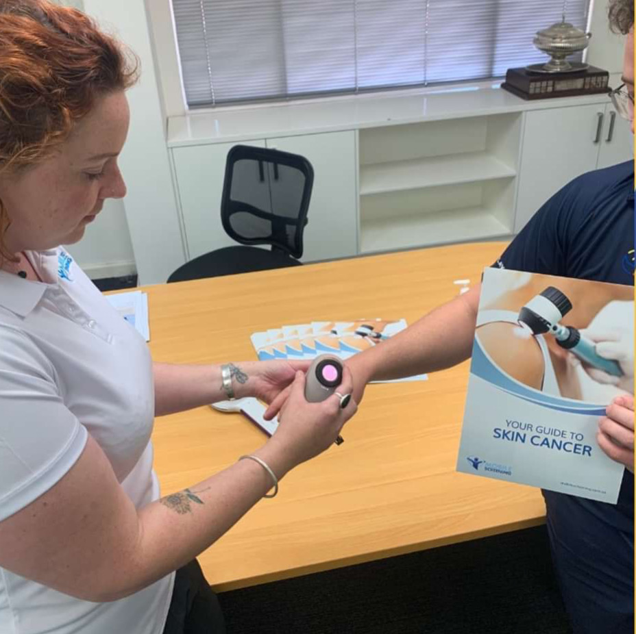 Onsite workplace skin check being performed during winter by Mobile Screening staff