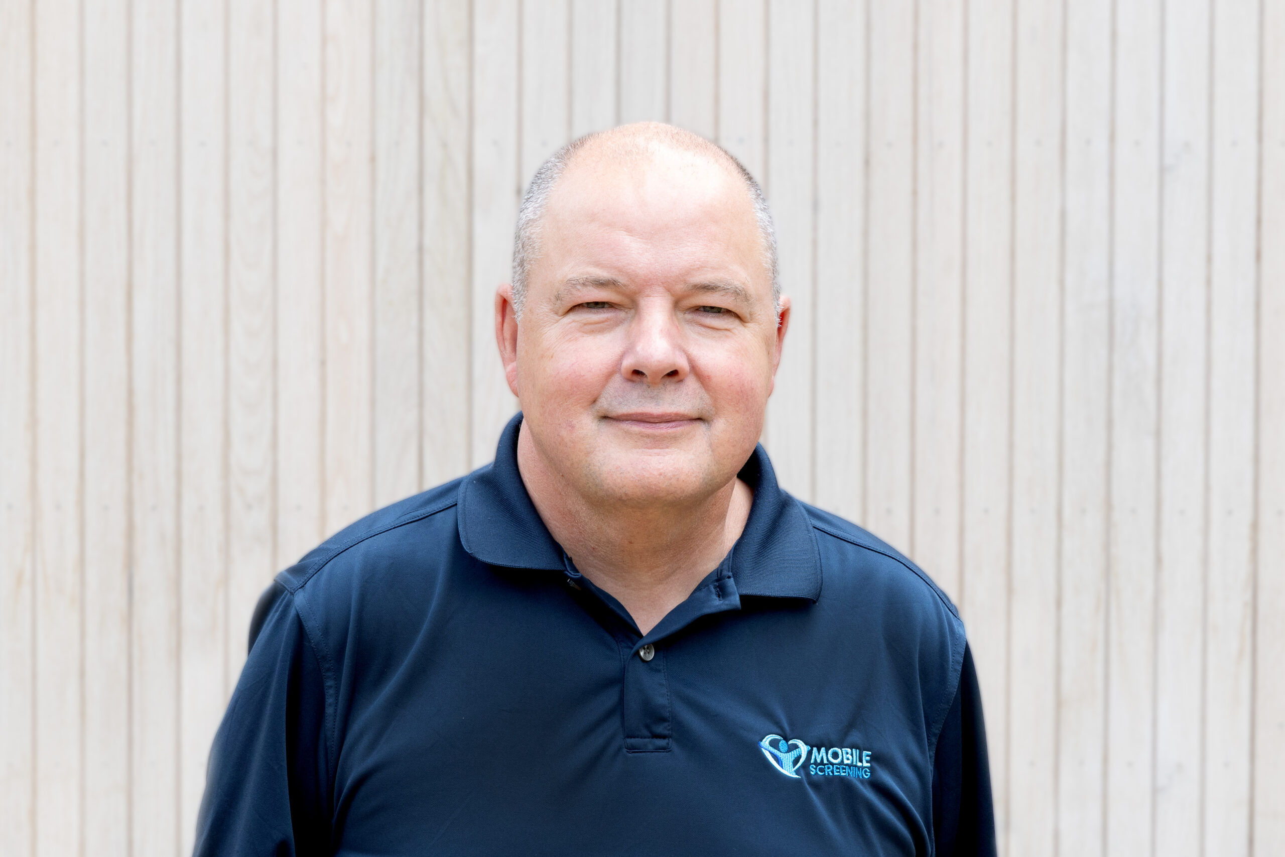 Portrait of Simon Holt, owner of Mobile Screening since 2016, who has driven national growth while maintaining the company’s long-standing focus on exceptional customer service, workplace health screening and occupational hygiene.